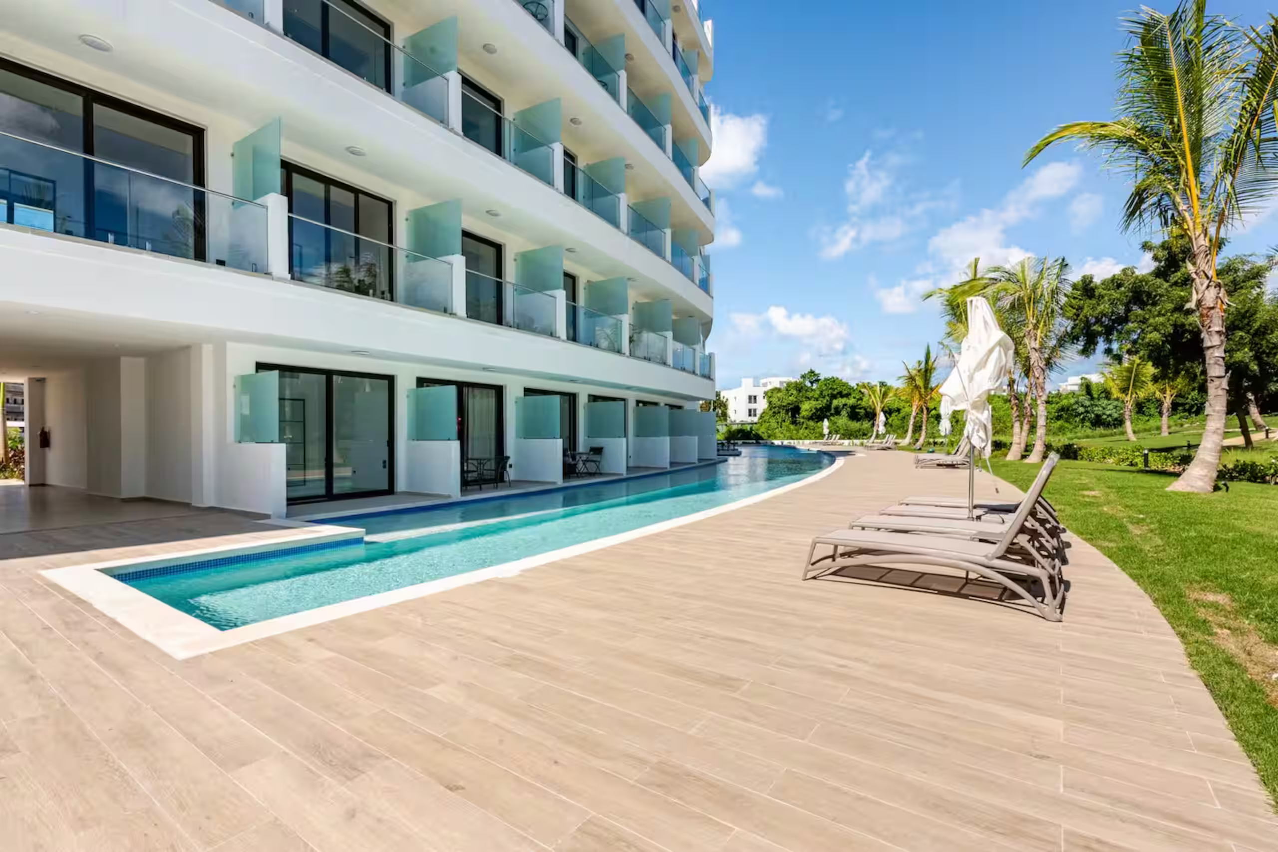 Cana Rock Universe building with swim-up terraces opening onto the pool